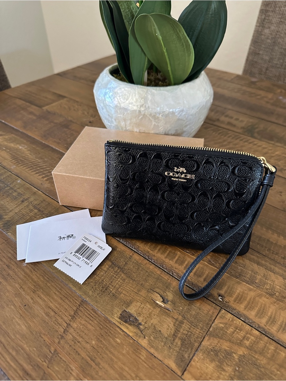 Black Coach Corner Zip Wristlet in Signature Black Debossed Patent Leather. - Picture 2 of 5